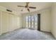 Spacious bedroom featuring carpeting, a ceiling fan, and access to a private balcony at 1034 Tam O Shanter, Las Vegas, NV 89109