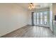 Small dining area with light wood-look tile floors and bright glass doors to the outside at 1034 Tam O Shanter, Las Vegas, NV 89109