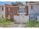 Charming townhouse with a brick facade, balcony, and a quaint fenced-in yard with easy access at 1034 Tam O Shanter, Las Vegas, NV 89109