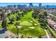 Picturesque golf course with manicured greens, sand traps, and lush landscaping with city views in the background at 1034 Tam O Shanter, Las Vegas, NV 89109