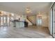 Spacious open-concept living room with bar seating and light wood-look tile floors at 1034 Tam O Shanter, Las Vegas, NV 89109