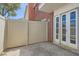 Private patio area with access to the home through elegant french doors, enclosed by a light-colored fence at 1034 Tam O Shanter, Las Vegas, NV 89109