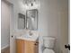 Contemporary half-bathroom with modern vanity, countertop, faucet and framed mirror at 10530 Eagle Nest St, Las Vegas, NV 89141