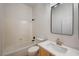 Bright bathroom featuring a tub, vanity with marble counter, sink, and modern fixtures at 10530 Eagle Nest St, Las Vegas, NV 89141