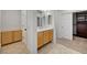 A well-appointed bathroom with a vanity, walk-in closet, and stylish cabinets offers modern convenience and ample storage at 10530 Eagle Nest St, Las Vegas, NV 89141
