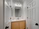 Contemporary half-bathroom with modern vanity, countertop, faucet and framed mirror at 10530 Eagle Nest St, Las Vegas, NV 89141