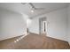 Bedroom featuring carpet flooring, a ceiling fan, and multiple doors at 10530 Eagle Nest St, Las Vegas, NV 89141