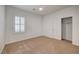 Neutral bedroom featuring carpeted floors, a ceiling fan, window with shutters and closet at 10530 Eagle Nest St, Las Vegas, NV 89141