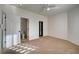 Neutral bedroom featuring carpeted floors, a ceiling fan, two doors and closet at 10530 Eagle Nest St, Las Vegas, NV 89141