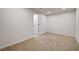 Spacious carpeted bedroom with neutral walls and a doorway leading outside at 10530 Eagle Nest St, Las Vegas, NV 89141