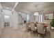 Dining area with tile flooring, staircase view, and adjacent half bathroom at 10530 Eagle Nest St, Las Vegas, NV 89141