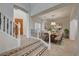 Elegant dining room features a wooden table, upholstered chairs, and view of the front entrance at 10530 Eagle Nest St, Las Vegas, NV 89141