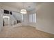 Bright dining area with tile flooring, staircase view, and plantation shutters at 10530 Eagle Nest St, Las Vegas, NV 89141
