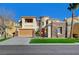 Beautiful two-story home with a three-car garage, stone accents, and drought-tolerant landscaping at 10530 Eagle Nest St, Las Vegas, NV 89141