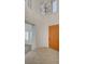 Bright foyer featuring high ceilings, a modern chandelier, and tiled floors at the entrance at 10530 Eagle Nest St, Las Vegas, NV 89141