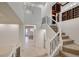 Open foyer with decorative wrought iron banister, access to living spaces, and natural light at 10530 Eagle Nest St, Las Vegas, NV 89141