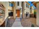 Close up of home's front door and entrance, showing desert landscaping and decorative stone accents at 10530 Eagle Nest St, Las Vegas, NV 89141