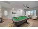 Entertainment loft features a pool table and stylish seating area at 10530 Eagle Nest St, Las Vegas, NV 89141