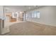 Spacious living room featuring neutral carpeting and abundant natural light at 10530 Eagle Nest St, Las Vegas, NV 89141