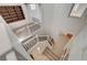 An elegant staircase with decorative iron railings leads to the upper level, highlighting architectural details and neutral tones at 10530 Eagle Nest St, Las Vegas, NV 89141