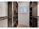 Closet with custom shelving, window and ample storage, perfect for organization at 10530 Eagle Nest St, Las Vegas, NV 89141