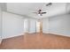 Spacious bedroom featuring wood-look floors, neutral paint, and a ceiling fan at 11356 Belmont Lake Dr # 103, Las Vegas, NV 89135