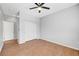 Empty bedroom with ceiling fan, and closet with wood-look flooring at 11356 Belmont Lake Dr # 103, Las Vegas, NV 89135