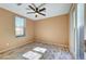 A light-filled bedroom featuring wood floors, neutral walls, and a ceiling fan at 11356 Belmont Lake Dr # 103, Las Vegas, NV 89135