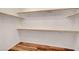 Walk-in closet with wood floor and built-in shelves, providing ample storage space at 11356 Belmont Lake Dr # 103, Las Vegas, NV 89135