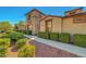 Well-maintained home featuring manicured landscaping and a charming walkway leading to the front entrance at 11356 Belmont Lake Dr # 103, Las Vegas, NV 89135