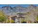 Townhome exteriors with mountain views in background at 11356 Belmont Lake Dr # 103, Las Vegas, NV 89135