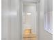 Hallway view leading to bathroom featuring tile flooring and a white tub shower at 11356 Belmont Lake Dr # 103, Las Vegas, NV 89135