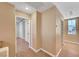 Upstairs hallway featuring wood flooring, neutral paint, and doors to other rooms at 11356 Belmont Lake Dr # 103, Las Vegas, NV 89135