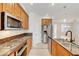 Well-equipped kitchen with stainless steel appliances, granite counters, and ample cabinet space at 11356 Belmont Lake Dr # 103, Las Vegas, NV 89135