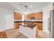 Modern kitchen with granite countertops, stainless steel appliances, an island with a sink, and ample storage space at 11356 Belmont Lake Dr # 103, Las Vegas, NV 89135