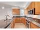 A gourmet kitchen features granite countertops, stainless appliances, and beautiful wood cabinetry at 11356 Belmont Lake Dr # 103, Las Vegas, NV 89135