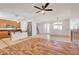 Bright open-concept living space with a modern kitchen and a combined tile and wood-style floor design at 11356 Belmont Lake Dr # 103, Las Vegas, NV 89135