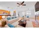 Comfortable living space featuring an open-concept design with a kitchen and a combined tile and wood-style floor design at 11356 Belmont Lake Dr # 103, Las Vegas, NV 89135
