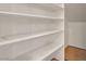 A walk-in pantry with ample shelving to keep groceries neatly stored and organized at 11356 Belmont Lake Dr # 103, Las Vegas, NV 89135