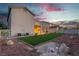 Large backyard with artificial turf, mature trees, and a covered patio for outdoor enjoyment at 1136 Casady Hollow Ave, Henderson, NV 89012