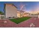 The backyard features manicured landscaping, perfect for relaxing or entertaining outdoors at 1136 Casady Hollow Ave, Henderson, NV 89012