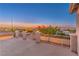 Open balcony with railing offers panoramic city and mountain views under a colorful evening sky at 1136 Casady Hollow Ave, Henderson, NV 89012