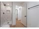 Modern bathroom with walk-in shower, tiled walls, and matte black fixtures at 1136 Casady Hollow Ave, Henderson, NV 89012