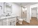 Bathroom features a vanity, white toilet, shower, and tile flooring. The space looks very modern at 1136 Casady Hollow Ave, Henderson, NV 89012