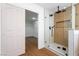 Sleek bathroom featuring a glass enclosed shower and walk-in closet at 1136 Casady Hollow Ave, Henderson, NV 89012