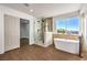 Modern bathroom with soaking tub, frameless shower, and spacious closet at 1136 Casady Hollow Ave, Henderson, NV 89012