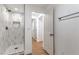 Modern bathroom features a tiled shower with built-in niche and black hardware at 1136 Casady Hollow Ave, Henderson, NV 89012