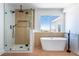Spa-like bathroom with a modern shower, soaking tub, and stylish fixtures at 1136 Casady Hollow Ave, Henderson, NV 89012