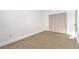 Bright bedroom features neutral carpet and a large closet, providing ample storage space at 1136 Casady Hollow Ave, Henderson, NV 89012