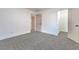 Cozy bedroom with neutral carpet, white trim, and easy access to a walk-in closet at 1136 Casady Hollow Ave, Henderson, NV 89012